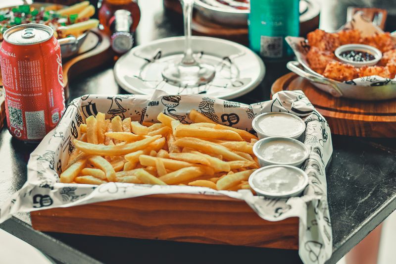 Crispy seasoned fries with dipping sauce