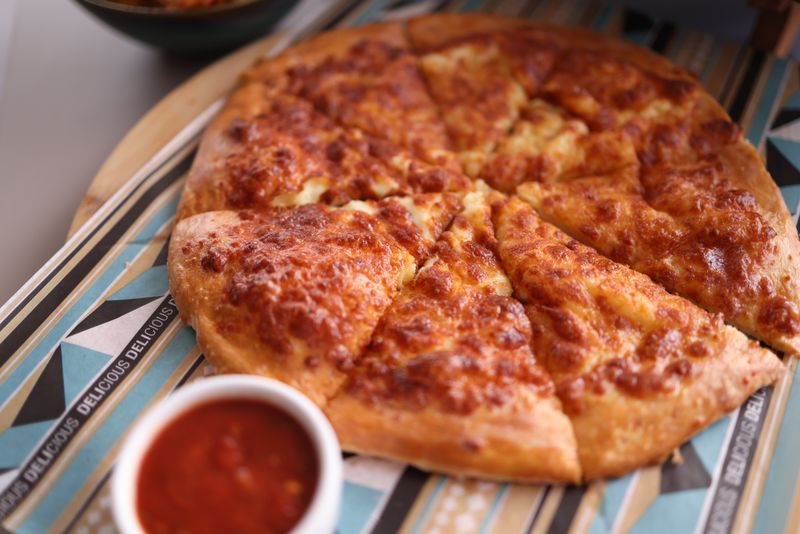 Cheesy breadsticks with marinara dipping sauce